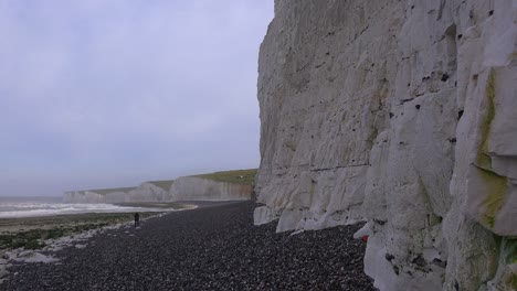 A-distant-woman-walks-along-the-White-Cliffs-of-Dover-near-Beachy-Head-in-Southern-England