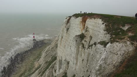 A-lighthouse-along-the-White-Cliffs-of-Dover-near-Beachy-Head-in-Southern-England