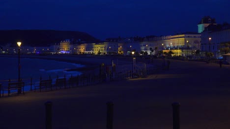Elegant-hotels-line-a-beachfront-at-night-in-England-1