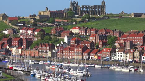 An-establishing-shot-of-the-town-of-Whitby-England-with-port-and-abbey-cathedral-distant