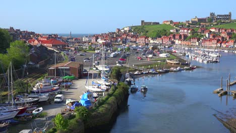 An-establishing-shot-of-the-town-of-Whitby-England-with-port-and-abbey-cathedral-distant-1