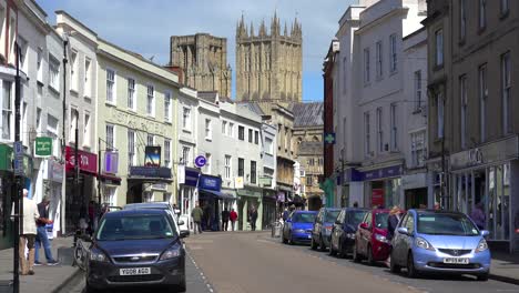 An-establishing-shot-of-the-town-of-Wells-England-with-a-busy-street-foreground
