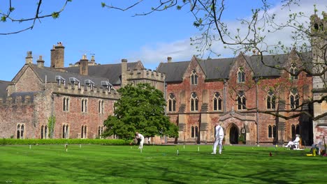 Seniors-play-croquet-on-the-grounds-of-an-elaborate-mansion-in-Great-Britain