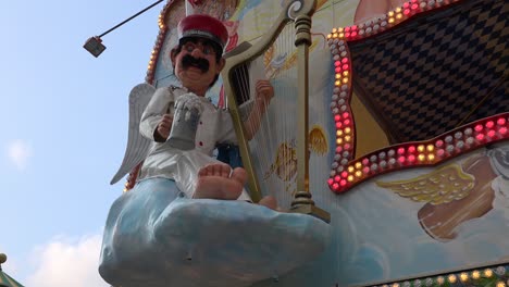 An-animated-German-figure-raises-his-beer-glass-during-Oktoberfest-in-Munich
