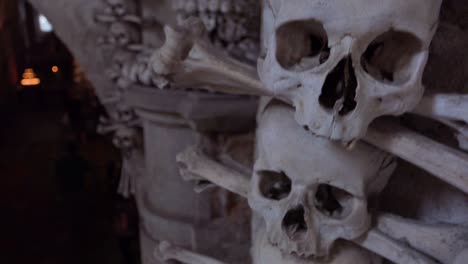 Skulls-and-bones-hang-from-the-walls-at-the-Sedlec-Ossuary-in-the-Czech-Republic-1