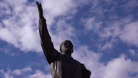 Time-lapse-behind-old-Lenin-statue-rusting-in-Memento-Park-outside-Budapest-Hungary