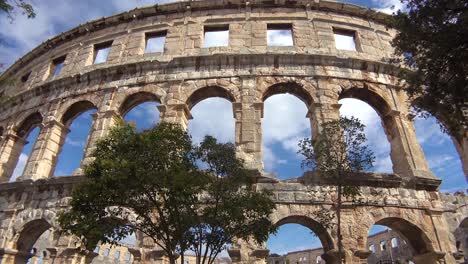 Panning-view-looking-up-at-the-remarkable-Roman-amphitheater-in-Pula-Croatia