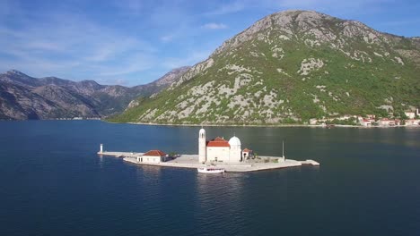 Beautiful-aerial-over-the-Our-Lady-rock-island-church-in-Boka-Bay-Montenegro