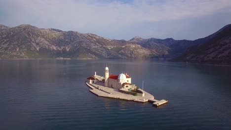 Beautiful-aerial-over-the-Our-Lady-rock-island-church-in-Boka-Bay-Montenegro-3
