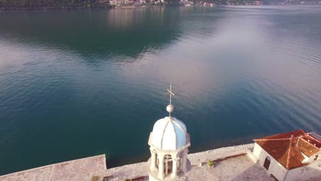 Beautiful-aerial-over-the-Our-Lady-rock-island-church-in-Boka-Bay-Montenegro-7