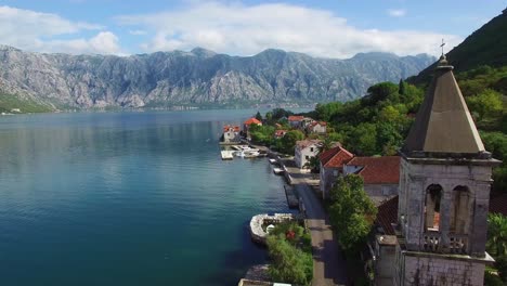 Stunning-aerial-of-an-attractive-village-on-the-shores-of-Boka-Bay-Montenegro-1