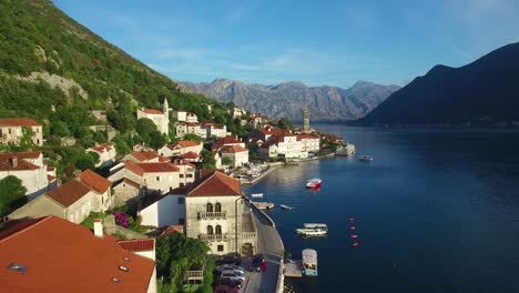 Stunning-aerial-of-an-attractive-village-on-the-shores-of-Boka-Bay-Montenegro-3