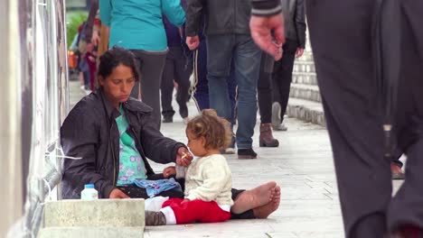 A-woman-begs-with-her-children-on-the-streets-of-Tirana-Albania