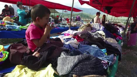 Little-boy-in-a-large-outdoor-gypsy-flea-market-in-the-Alps-of-Albania