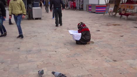 A-woman-begs-with-her-children-on-the-streets-of-Skopje-Macedonia