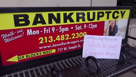 An-anti-Trump-poster-is-left-on-a-bench-advertising-bankruptcy