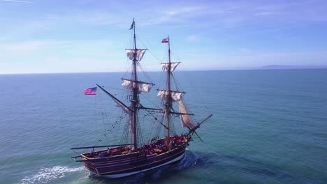 Spectacular-aerial-following-a-tall-sailing-ship-on-the-open-ocean-by-day-7