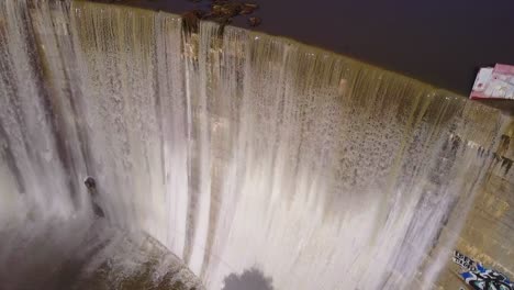 Beautiful-aerial-over-a-high-waterfall-or-dam-in-full-flood-stage-near-Ojai-California-2
