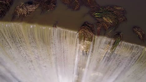 Beautiful-aerial-over-a-high-waterfall-or-dam-in-full-flood-stage-near-Ojai-California-4