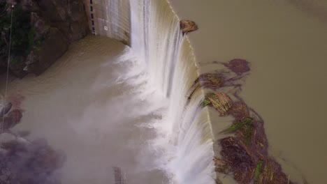 Beautiful-aerial-over-a-high-waterfall-or-dam-in-full-flood-stage-near-Ojai-California-6