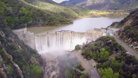 Beautiful-aerial-over-a-high-waterfall-or-dam-in-full-flood-stage-near-Ojai-California-10