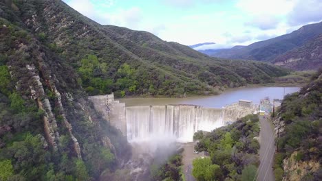 Beautiful-aerial-over-a-high-waterfall-or-dam-in-full-flood-stage-near-Ojai-California-11