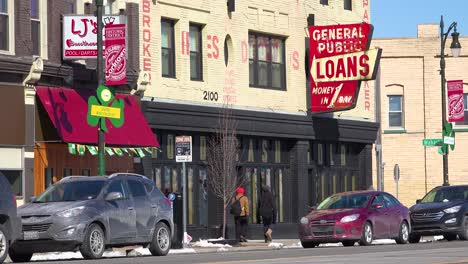 A-sign-along-a-busy-street-indicates-payday-loans-are-available