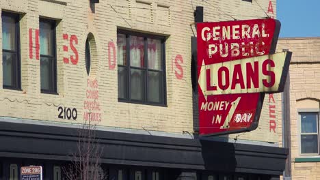 A-sign-along-a-busy-street-indicates-payday-loans-are-available-1