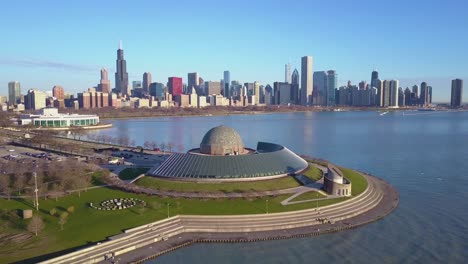 An-aerial-over-the-Adler-Planetarium-with-the-Chicago-skyline-in-the-background