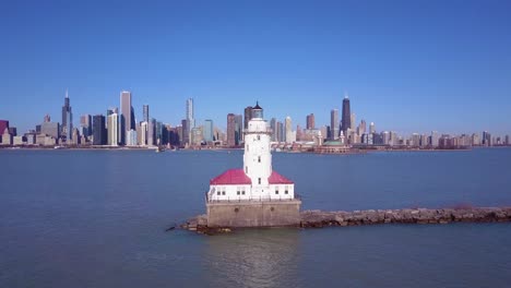 A-beautiful-aerial-around-an-iconic-lighthouse-on-Lake-Michigan-with-the-city-of-Chicago-distant--2