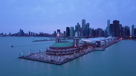 A-beautiful-aerial-around-Navy-Pier-in-Chicago-with-the-city-skyline-background-night-2