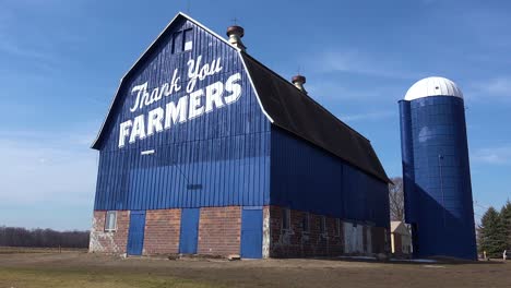 Low-angle-of-a-rural-barn-which-says-Thank-You-Farmers-1