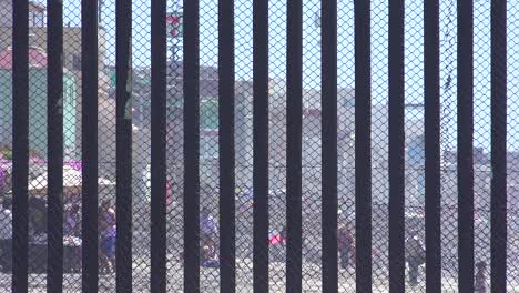 Mexican-visit-the-beach-at-the-US-Mexico-border-fence-in-the-Pacific-Ocean-between-San-Diego-and-Tijuana-2