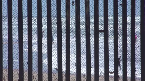 Mexicans-enjoy-the-beach-at-the-US-Mexico-border-fence-in-the-Pacific-Ocean-between-San-Diego-and-Tijuana-1