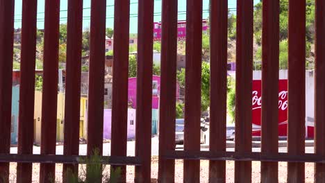 A-view-through-the-US-Mexico-border-wall-towards-the-city-of-Nogales-on-the-other-side