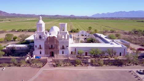 A-beautiful-aerial-establishing-shot-of-Mission-San-Xavier-del-Bac-a-historic-Spanish-Catholic-mission-near-Tucson-Arizona-1