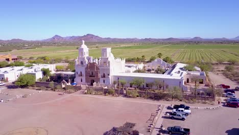 A-beautiful-aerial-establishing-shot-of-Mission-San-Xavier-del-Bac-a-historic-Spanish-Catholic-mission-near-Tucson-Arizona-2