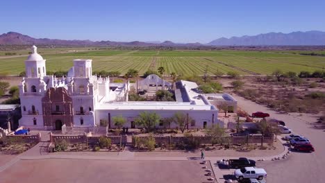 A-beautiful-aerial-establishing-shot-of-Mission-San-Xavier-del-Bac-a-historic-Spanish-Catholic-mission-near-Tucson-Arizona-3