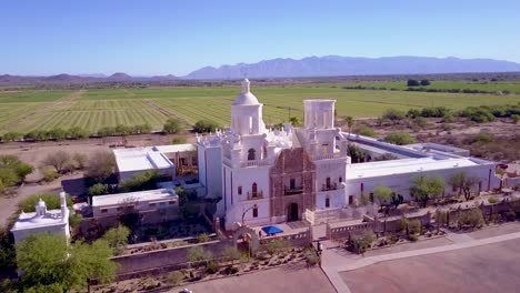 A-beautiful-aerial-establishing-shot-of-Mission-San-Xavier-del-Bac-a-historic-Spanish-Catholic-mission-near-Tucson-Arizona-4