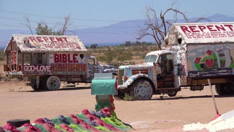 A-trailer-painted-with-Bible-verses-sits-in-the-desert-in-Slab-City-California-1