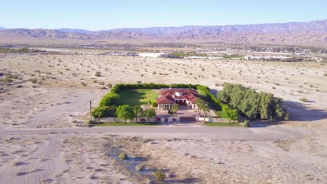 A-dramatic-aerial-reveals-a-large-mansion-in-miles-of-lonely-desert-1