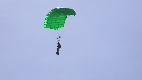 Elite-military-forces-and-paratroopers-skydive-onto-and-land-in-a-field-during-training-operations-1
