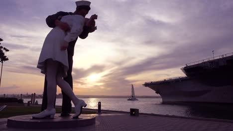 A-famous-statue-of-a-sailor-kissing-a-girl-at-the-end-of-World-War-Two-at-sunset-in-a-San-Diego-park