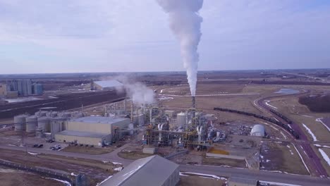 An-aerial-shot-over-an-oil-refinery-spewing-pollution-into-the-air