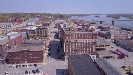 Rising-aerial-shot-over-small-town-America-Burlington-Iowa-downtown-with-Mississippi-River-background-1