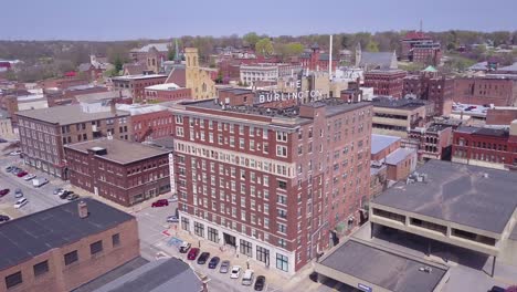 Rising-aerial-shot-over-small-town-America-Burlington-Iowa-downtown-with-Burlington-Hotel-visible
