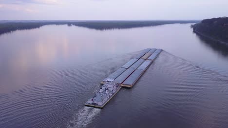 A-beautiful-aerial-of-a-barge-traveling-on-the-Mississippi-River-3