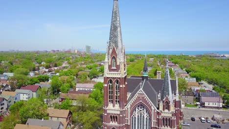 Beautiful-aerial-around-a-church-and-steeple-on-the-south-side-of-Chicago-Illinois