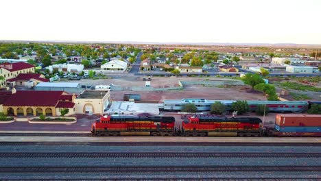 An-aerial-of-a-freight-train-passing-through-Winslow-Arizona