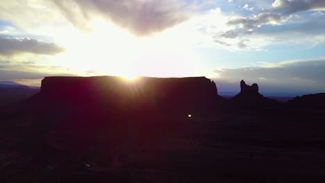 Beautiful-inspiring-aerial-at-sunset-over-rock-formations-in-Monument-Valley-Utah-at-sunset